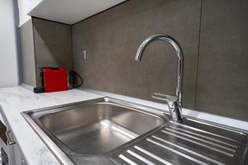 a kitchen sink with a faucet in a kitchen at Loft 53 - Twin Loft II by ΜΡS in Athens