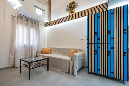 a living room with a couch and a table at Loft 53 - Twin Loft II by ΜΡS in Athens
