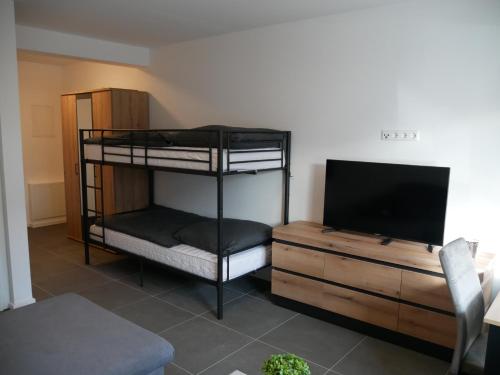 Ένα ή περισσότερα κρεβάτια σε δωμάτιο στο Herrnsheim Appartements