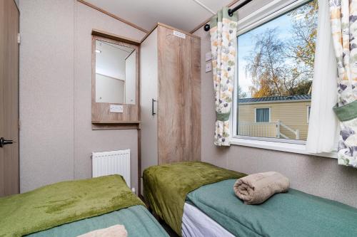 Ένα ή περισσότερα κρεβάτια σε δωμάτιο στο 3 Bedroom Caravan - Seton Sands