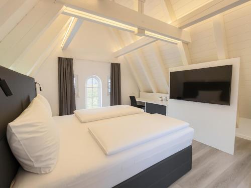 Postel nebo postele na pokoji v ubytování DORMERO Hotel Schwäbisch Hall