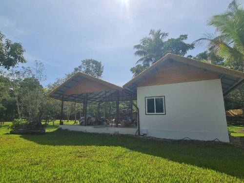 a small house with a pavilion in a yard at Koh kood Good Time by Jasmine in Ko Kood