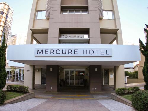 a large building with a sign that reads metroure hotel at Mercure Sao Paulo Vila Olimpia in Sao Paulo
