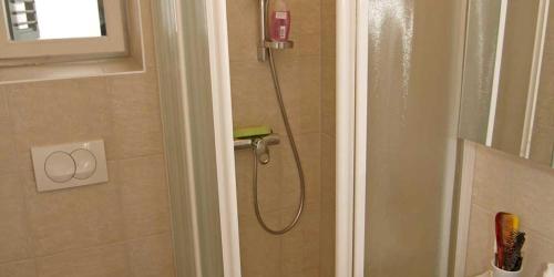 a shower in a bathroom with a shower at Mariana B4 in Veli Lošinj
