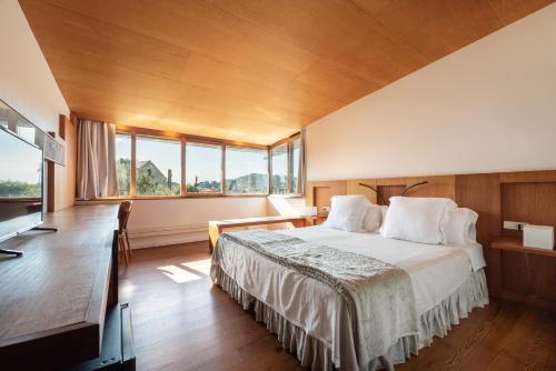 Postel nebo postele na pokoji v ubytování A casa de Aldán