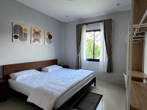 Ένα ή περισσότερα κρεβάτια σε δωμάτιο στο Nirvana Phangan 1