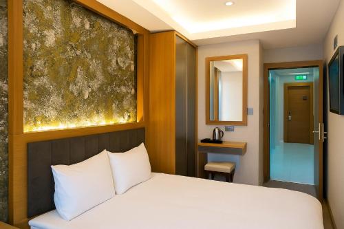 Postel nebo postele na pokoji v ubytování CALENBERG HOTEL