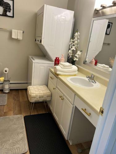 a bathroom with a sink and a mirror at The Porchlight retreat in Farmington Hills