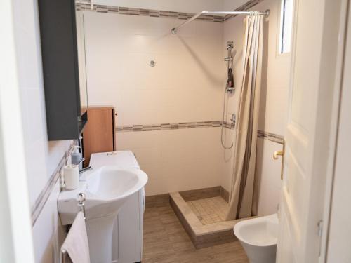 a bathroom with a sink and a shower at Holiday Home in Siracusa with garden in Floridia