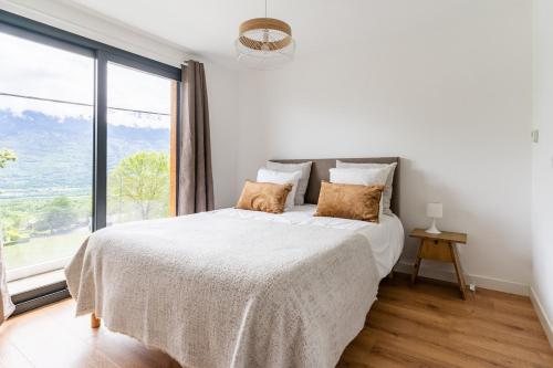 En eller flere senge i et værelse på Plancherine, Villa récente avec Jacuzzi Privatif