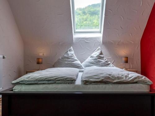 Ένα ή περισσότερα κρεβάτια σε δωμάτιο στο Holiday apartment Moselle valley