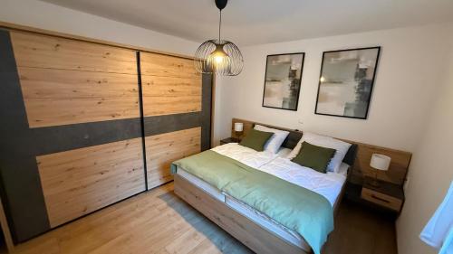 Ένα ή περισσότερα κρεβάτια σε δωμάτιο στο Alpine Oasis