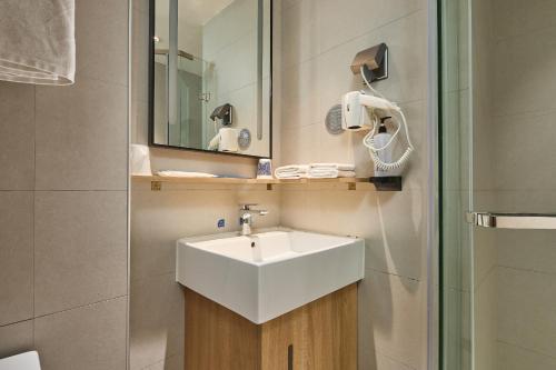 Ένα μπάνιο στο Urba Hotel Ganzhou Hongqi Avenue Branch