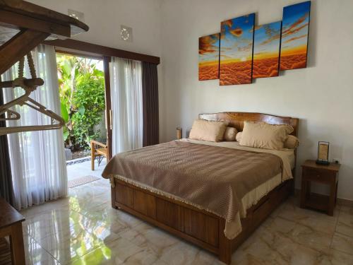 Ένα ή περισσότερα κρεβάτια σε δωμάτιο στο Ayanta Bali Homestay