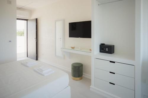 TV a/nebo společenská místnost v ubytování Suite La Perla Nera