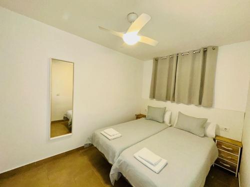 En eller flere senge i et værelse på ACAPULCO AMAZING VIEWS. POOL. FREE WIFI