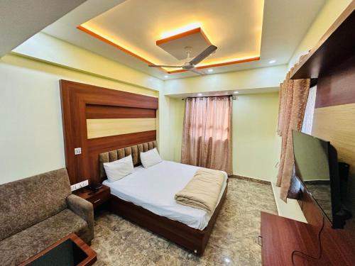 Postel nebo postele na pokoji v ubytování Hotel Anandam Residency