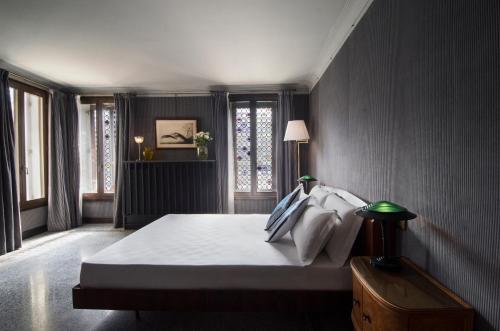 Ένα ή περισσότερα κρεβάτια σε δωμάτιο στο Ca' Dadda