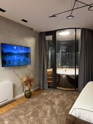 Postel nebo postele na pokoji v ubytování Domenéa Skyline Jacuzzi Retreat