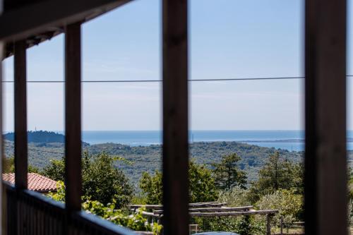 a view of the ocean from a window at Vila Sistiana in Kostanjevica na Krasu