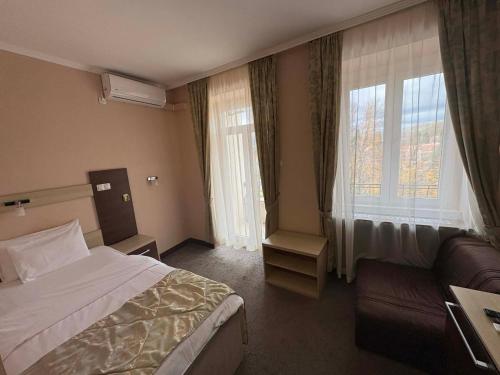 Ένα ή περισσότερα κρεβάτια σε δωμάτιο στο Hotel Leotar