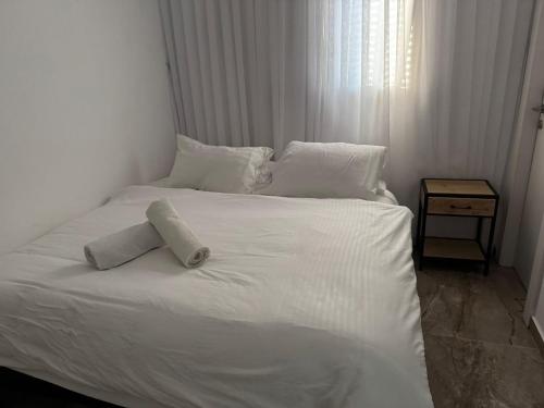 Ένα ή περισσότερα κρεβάτια σε δωμάτιο στο אחוזת חושן