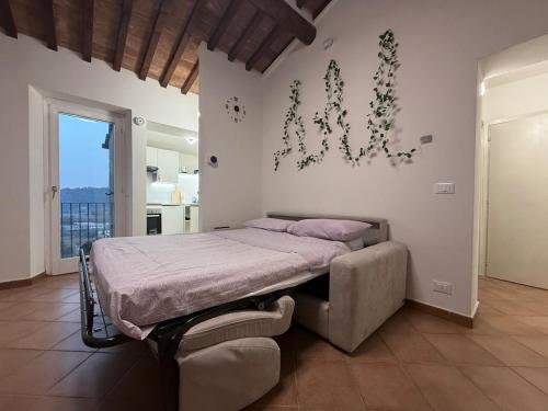 Ένα ή περισσότερα κρεβάτια σε δωμάτιο στο Il Poggiolino d'Oro