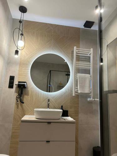 a bathroom with a sink and a mirror at U Sabały in Chochołów