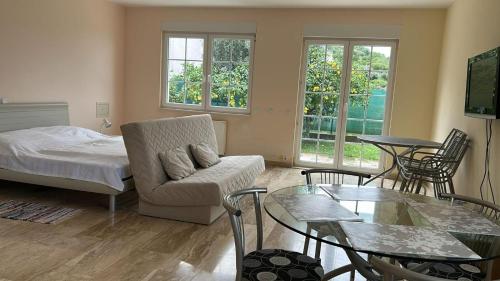 a living room with a couch and a table at Villa Valentina in Trpanj