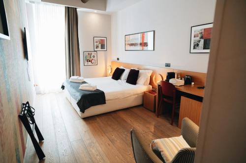 Ένα ή περισσότερα κρεβάτια σε δωμάτιο στο DownTown Boutique House - CA Domus Collection