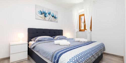 En eller flere senge i et værelse på Vacation house Orange