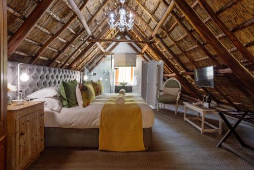 a bedroom with a large bed in a attic at Weltevreden Estate in Stellenbosch