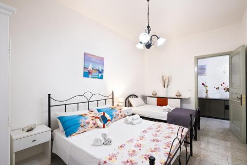 Ένα ή περισσότερα κρεβάτια σε δωμάτιο στο Villa Duna Moresca – Porto Cesareo