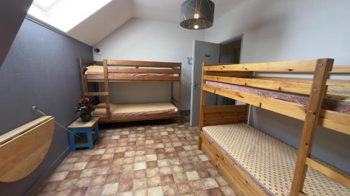 a room with two bunk beds in a room at Jappeloup in Saint-Germain