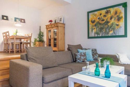 a living room with a couch and a table at Altstadt Ferienwohnung Wagner in Limburg an der Lahn