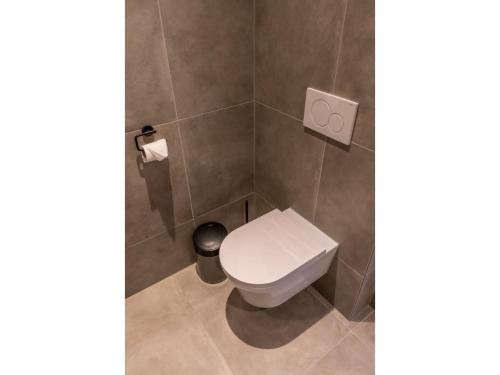 A bathroom at Modern villa in De Cocksdorp near the beach