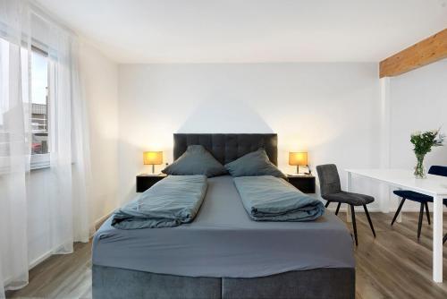 Una cama o camas en una habitación de Motel Ambiente 2 - Luxus Studio