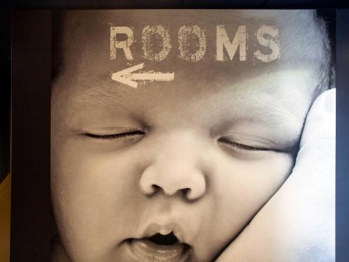 a baby with the word rooms on its head at ibis budget Beaconsfield in Beaconsfield