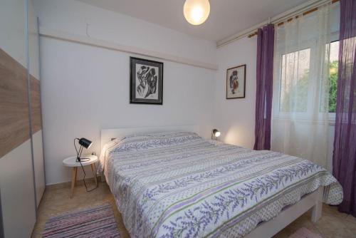 En eller flere senge i et værelse på Villa Branka