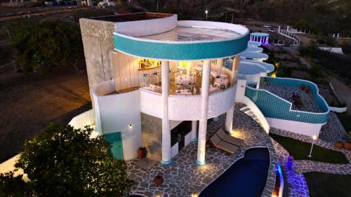 an aerial view of a building with a pool at Olymp Spa Boutique Hotel in Monte das Gameleiras