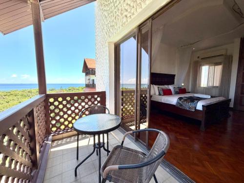 Ένα ή περισσότερα κρεβάτια σε δωμάτιο στο Libra Holiday Suites