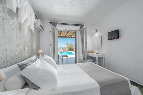 Ένα ή περισσότερα κρεβάτια σε δωμάτιο στο Thalasses Villas