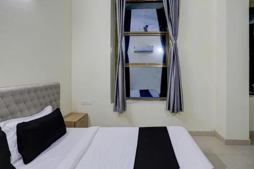 Ένα ή περισσότερα κρεβάτια σε δωμάτιο στο Hotel O Arena