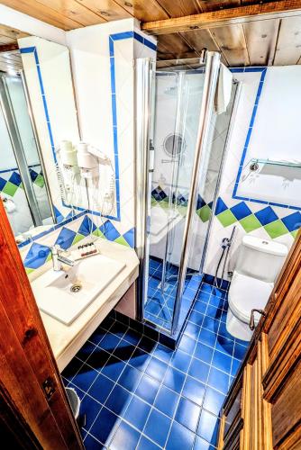 a bathroom with a sink and a toilet at Apartamentos Alhambra in Granada