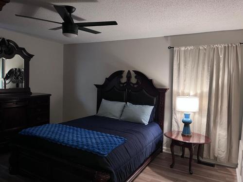 a bedroom with a bed and a ceiling fan at Your special Stay in Birmingham