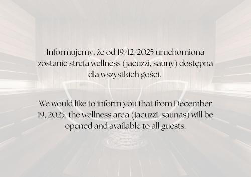 a white wall with a sign in front of a toilet at Apartamenty Krupówki 20 in Zakopane