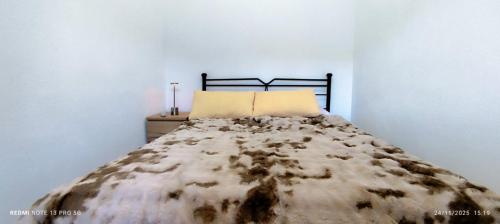 Ένα ή περισσότερα κρεβάτια σε δωμάτιο στο Αγιονέρι