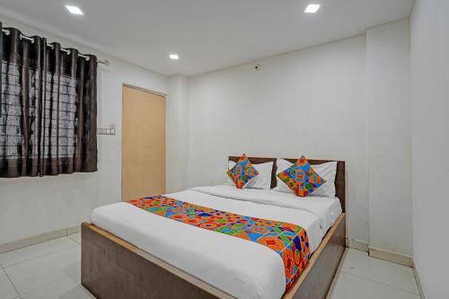 Ένα ή περισσότερα κρεβάτια σε δωμάτιο στο Via Ujwal Comforts