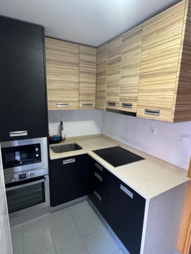 Η κουζίνα ή μικρή κουζίνα στο Piso con jardín en Liencres