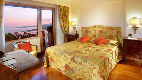 Un ou plusieurs lits dans un hébergement de l'établissement Hotel Villa Diodoro